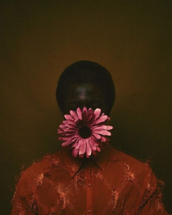 Portrait with a pink gerbera flower